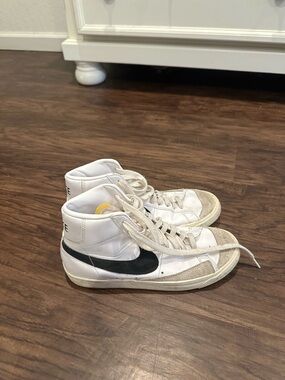 Nike White High-Top Sneakers with Black Swoosh